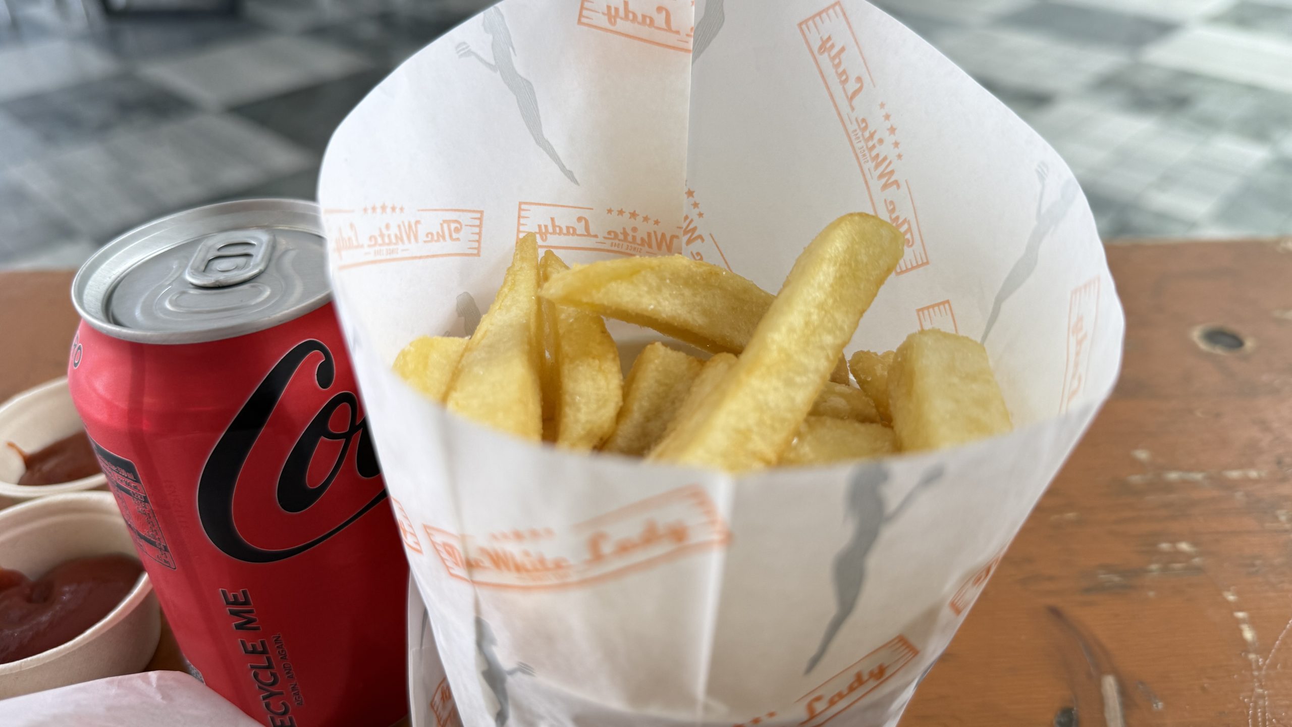 Thick cut Kiwi style fries from The White Lady Auckland served hot and crispy with vinegar and peri peri sauce.