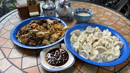 Signature Uyghur dish featuring smoky stir fried beef noodles with bold spices and deep flavours