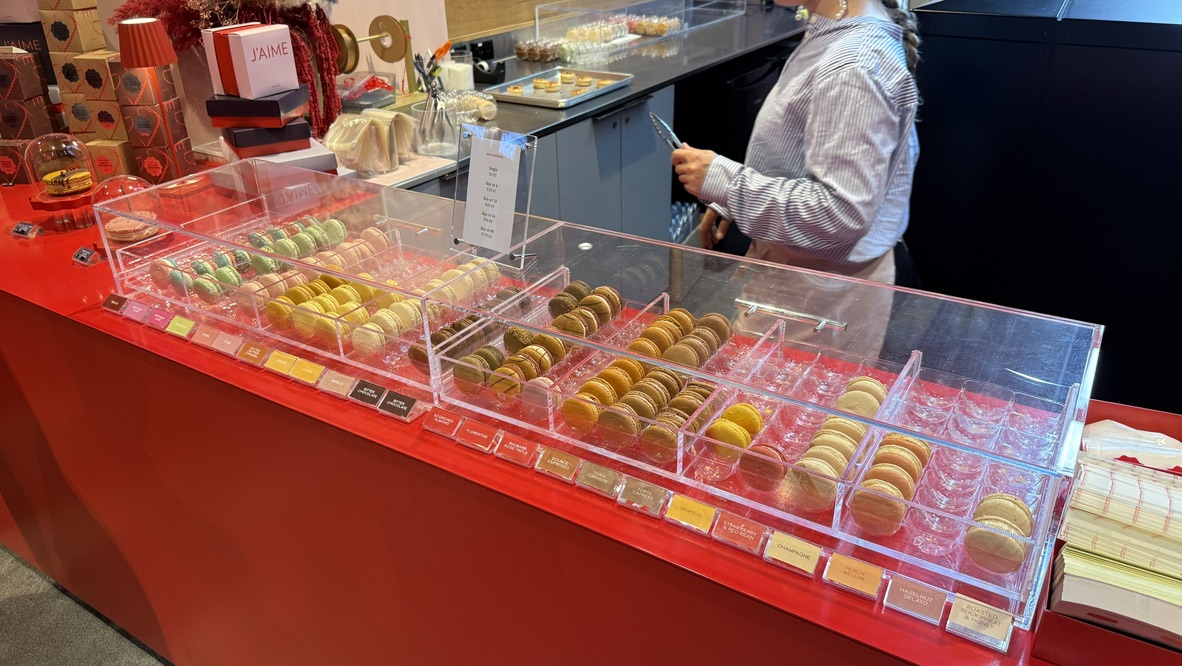 Colourful French macarons displayed at J'aime les Macarons in Commercial Bay Auckland, showcasing elegant presentation and premium dessert craftsmanship.- An Avid Traveller